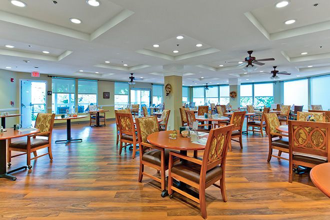 Spacious dining area with wooden floors and ample natural light.