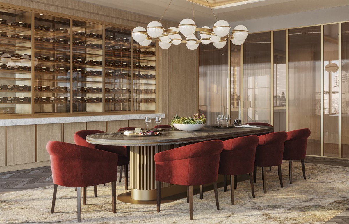 A luxurious dining room featuring elegant red chairs, modern furniture, and an impressive wine storage display.