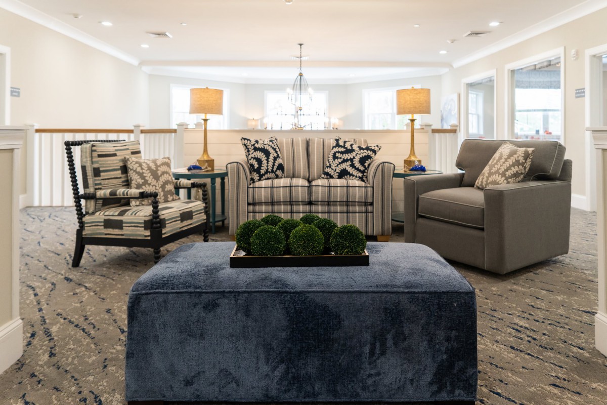 A cozy living room with stylish furniture and elegant lighting.