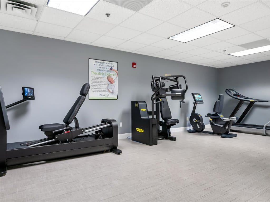 A well-equipped gym featuring various exercise machines for fitness enthusiasts.