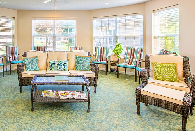 A cozy lounge area with comfortable seating and natural light.