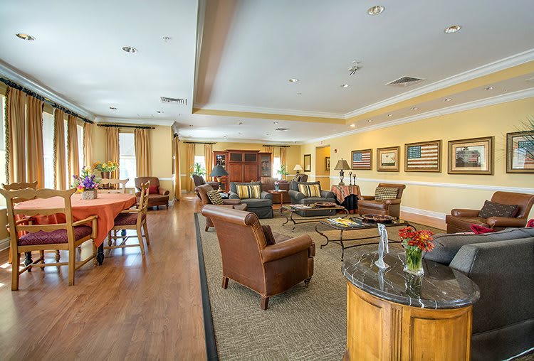A cozy living room with comfortable seating and elegant decor.