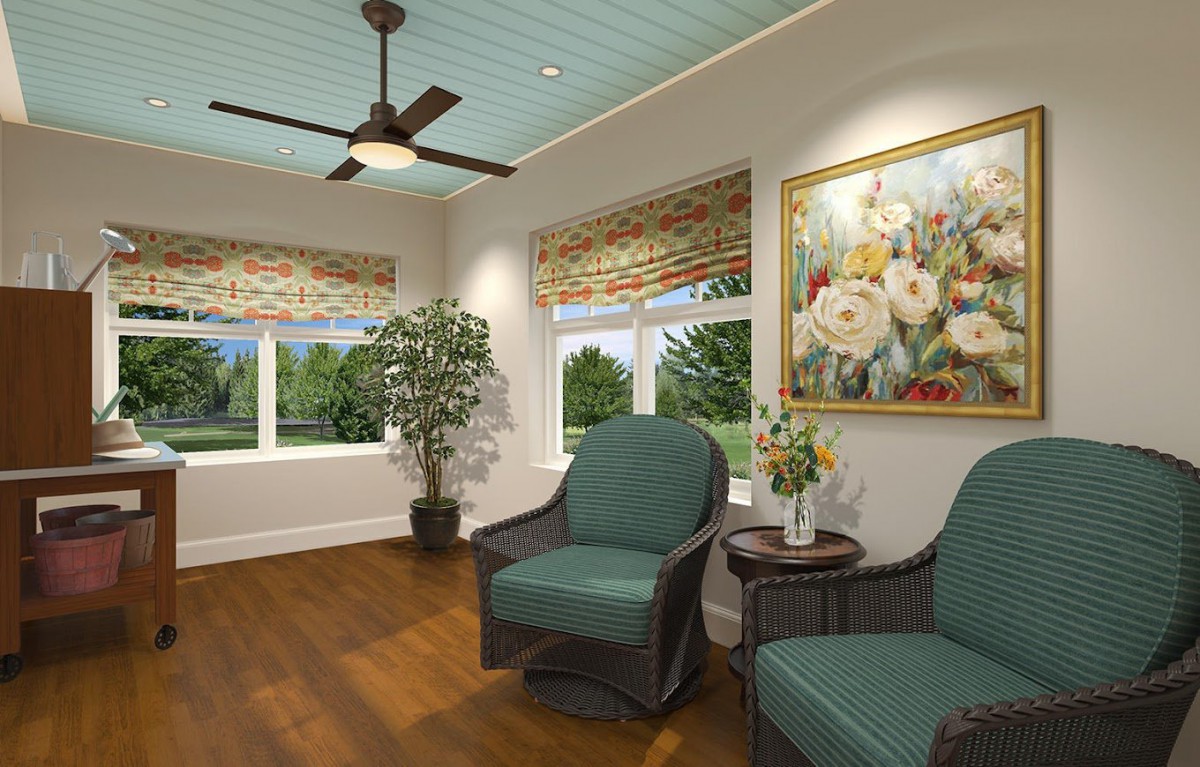 A cozy living room with comfortable chairs, a plant, and a colorful painting on the wall.