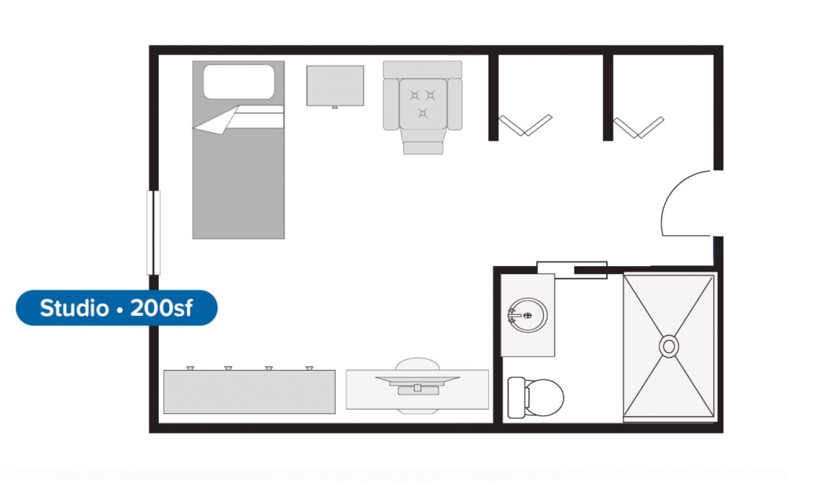 A floor plan showing the layout of a small apartment with a bedroom, bathroom, and kitchen.
