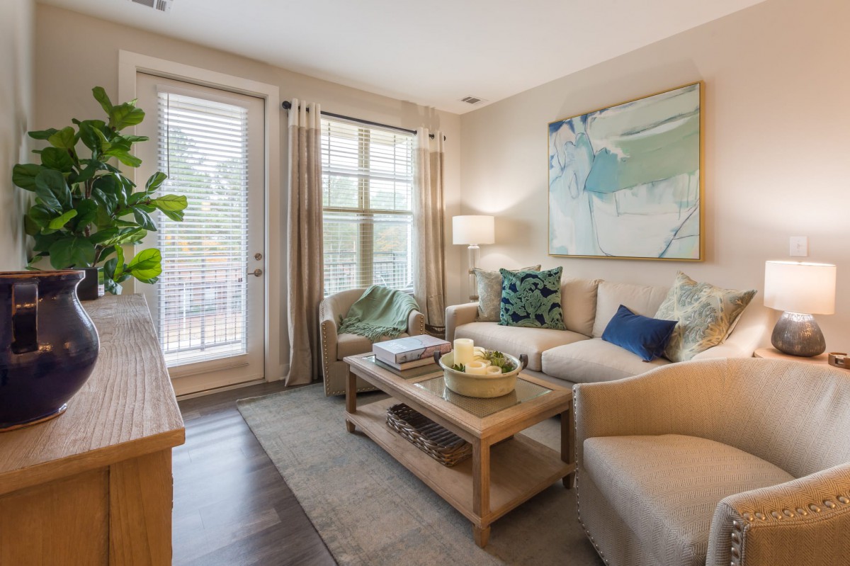 A cozy living room with a modern sofa, coffee table, and stylish decor.