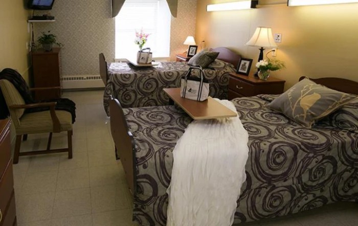 A cozy bedroom with twin beds and elegant decor.