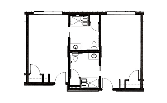 A blueprint of a floor plan showing the layout of rooms and bathrooms.