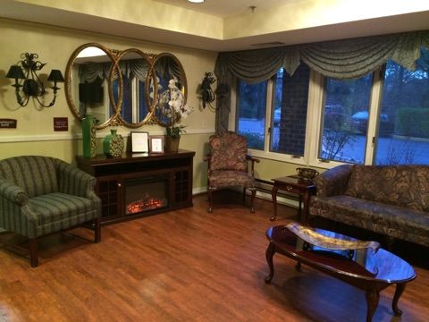 A cozy living room with elegant furniture and a warm ambiance.