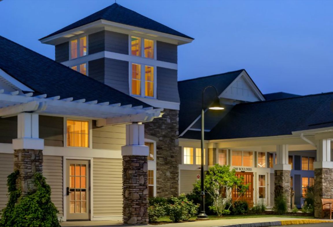 A well-lit house at night showcasing modern architectural design.