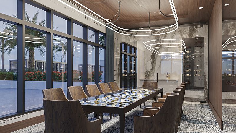 A modern dining room with a large table and elegant lighting.