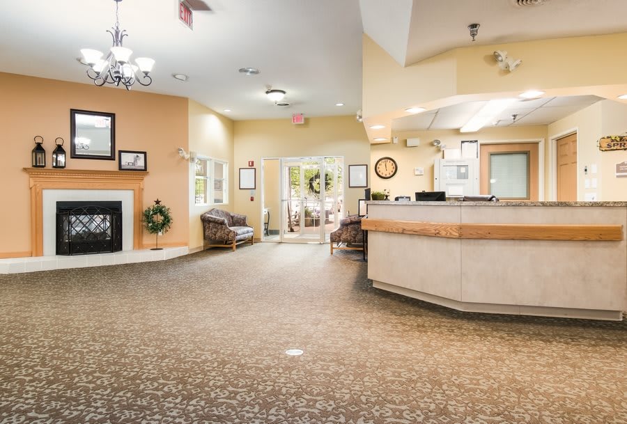 A welcoming lobby with a reception desk and waiting area.