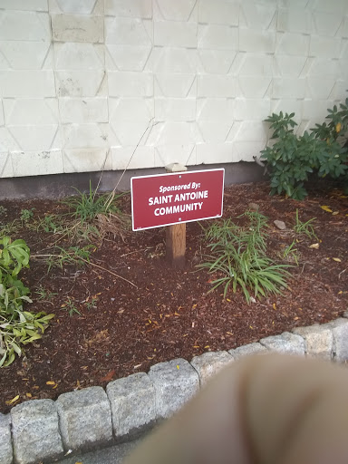 A sign indicating sponsorship for a community garden.