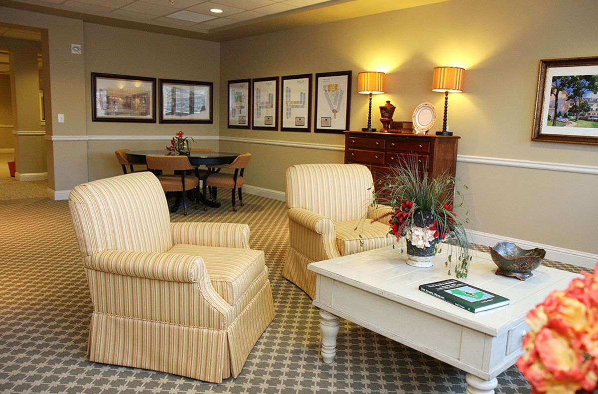 A cozy living room with comfortable seating and elegant decor.