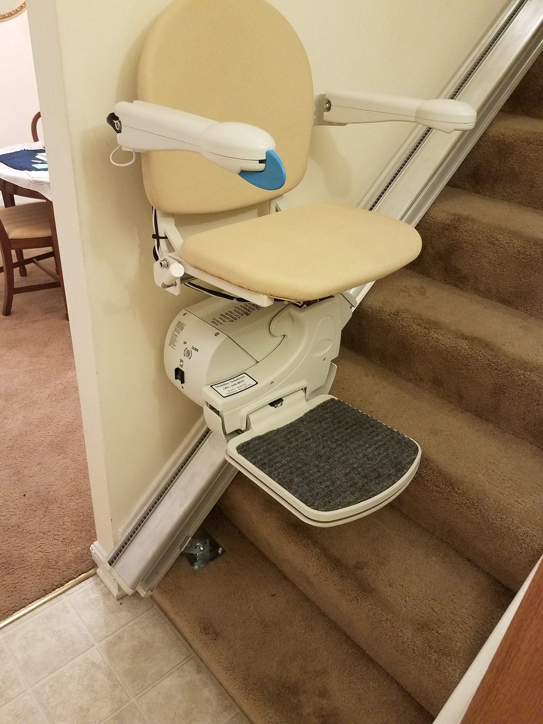 A stairlift installed on a residential staircase for accessibility.