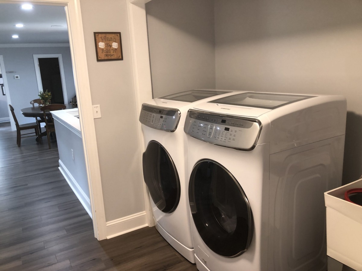 A modern laundry room featuring a washer and dryer set.