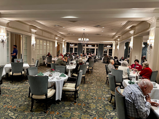 A cozy restaurant atmosphere filled with diners enjoying their meals.
