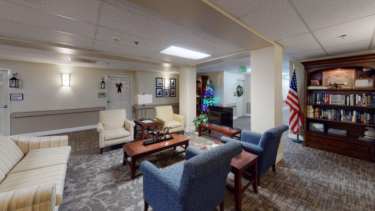 A cozy lobby area with seating arrangements and festive decorations.