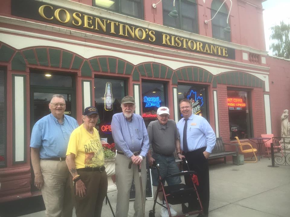 A group of people standing in front of Casentino's Restaurant.