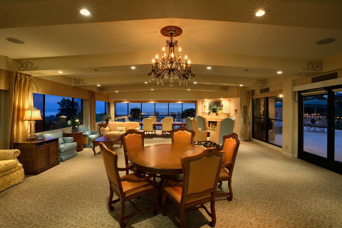 Luxurious dining room with elegant chandelier and stylish furniture.