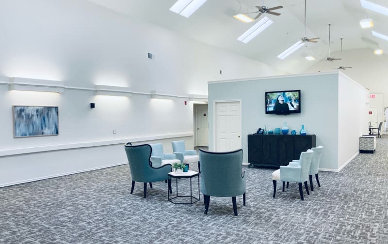 A modern lounge area with comfortable seating and a television.