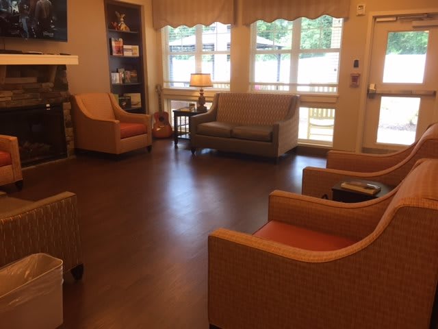 Cozy living room with comfortable seating and natural light.