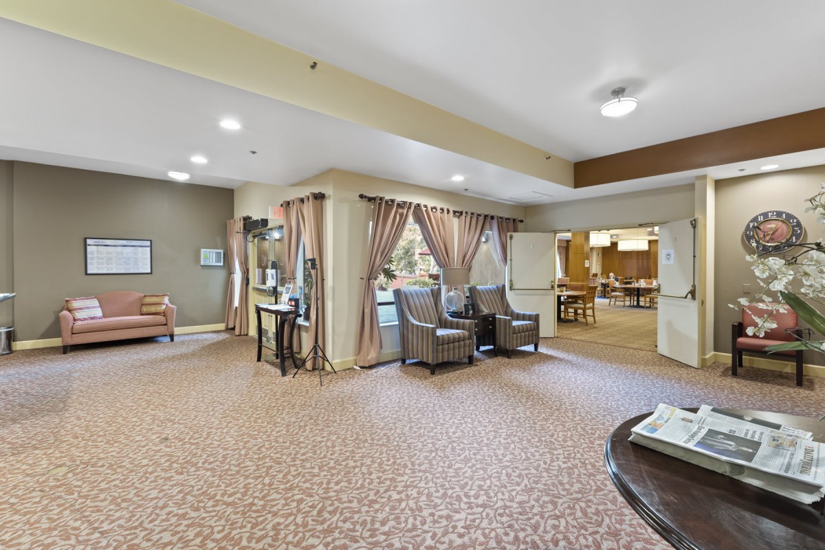 A spacious lobby area featuring comfortable seating and elegant decor.