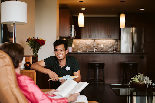 A cheerful moment shared between friends in a cozy kitchen setting.