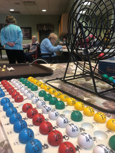 Participants enjoy a lively game of bingo, fostering community and social interaction.