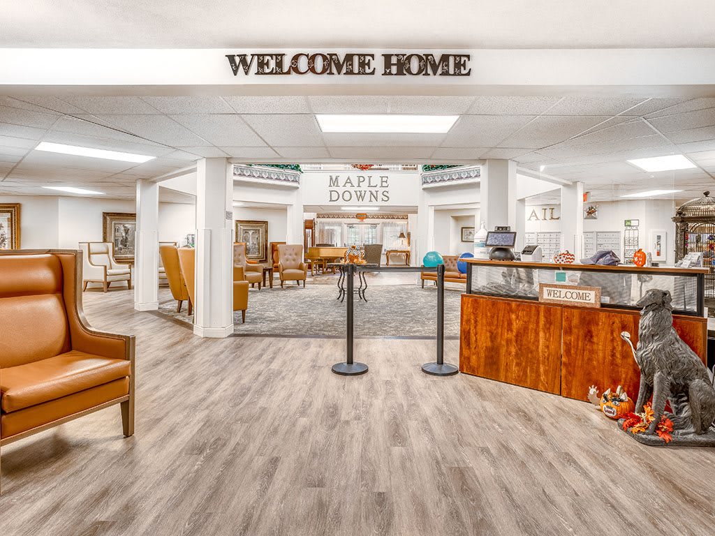 A warm and inviting furniture store with a welcome sign, showcasing various home decor items.