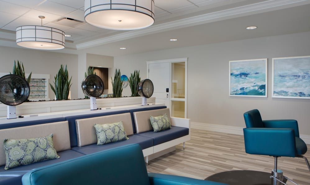 A modern lobby with stylish seating and decorative lighting.