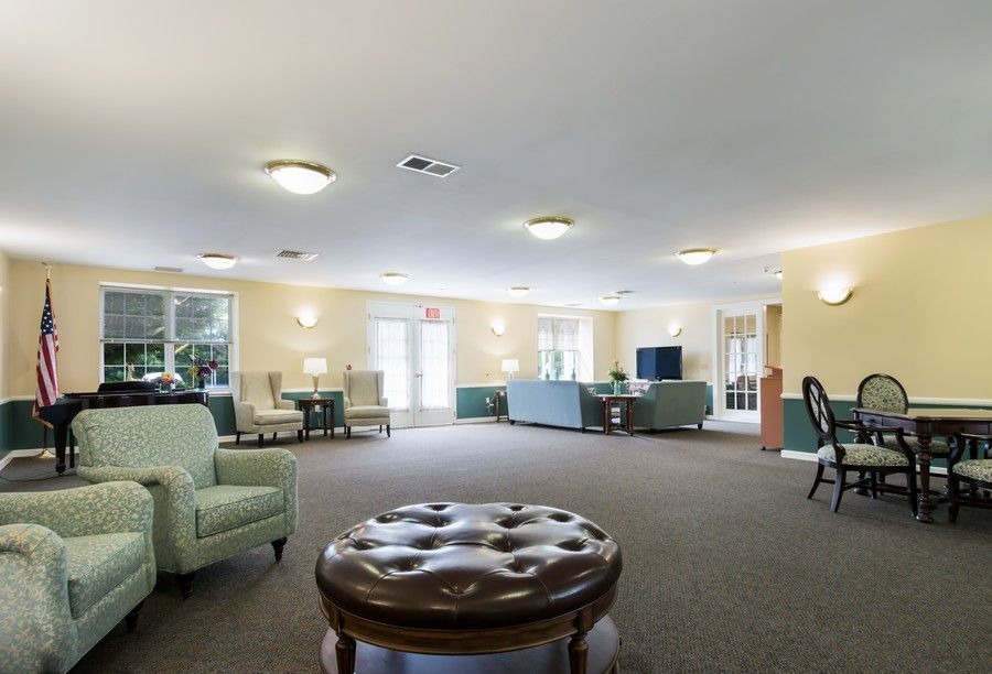 A spacious lounge area with comfortable seating and soft lighting.