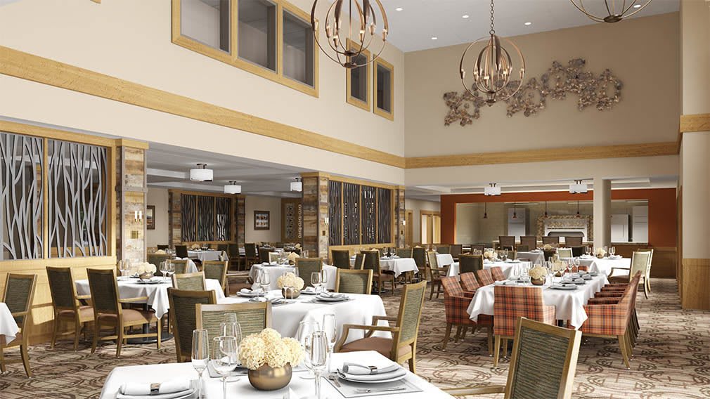An elegant restaurant dining area with neatly arranged tables and sophisticated chandeliers.