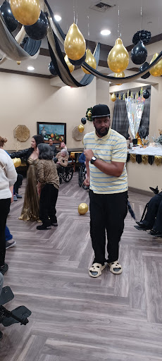 A lively dance event featuring attendees celebrating together in a festive indoor setting.