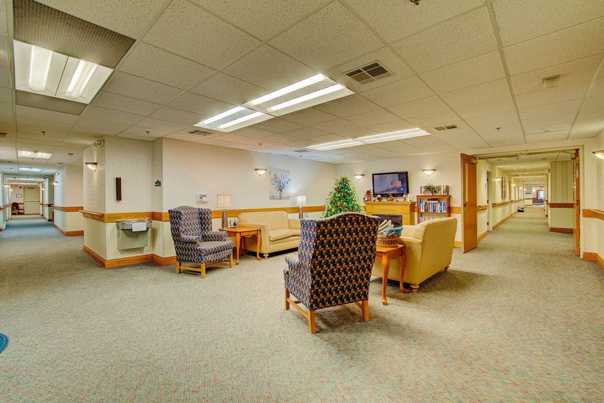 A cozy lounge area with comfortable seating and a television.