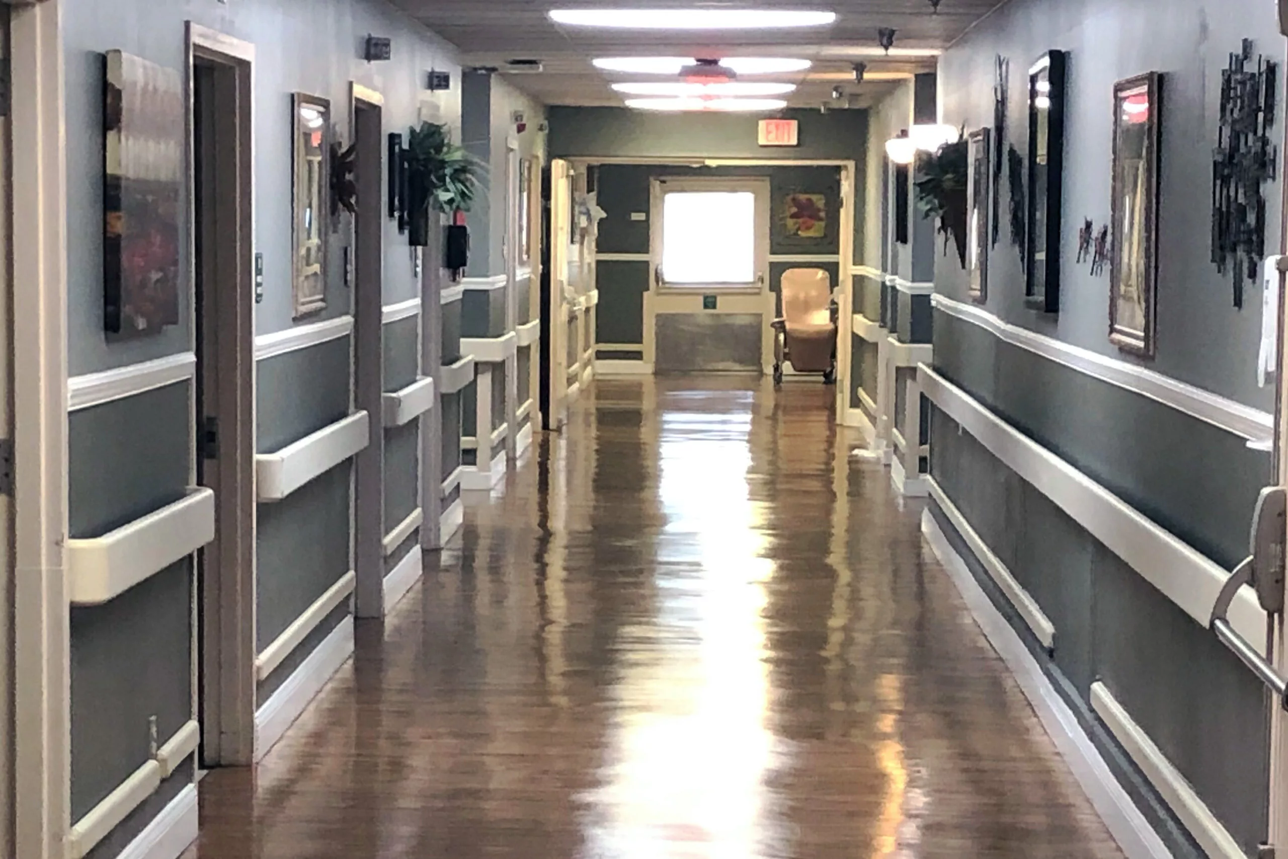 A well-lit and clean hallway in a building.