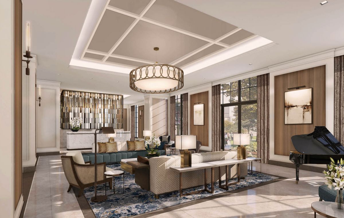 A luxurious and modern living room with elegant furniture and a large chandelier.
