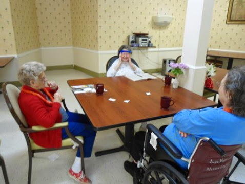 Seniors enjoying a quiet moment together at a care facility.