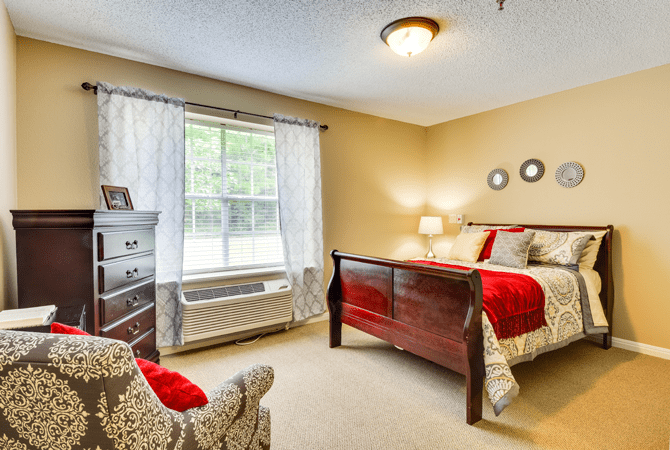 A cozy bedroom with elegant decor and natural lighting.
