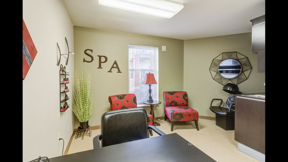 A cozy spa waiting area with decorative furniture and a welcoming ambiance.
