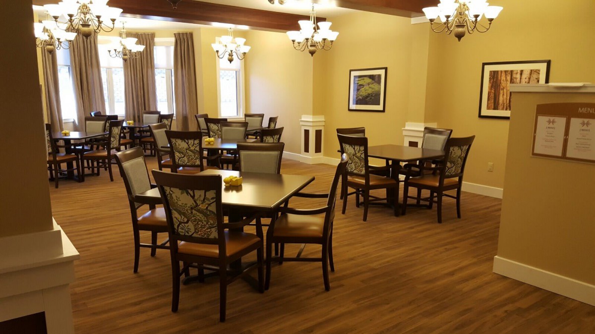 A cozy dining room with elegant furniture and warm lighting.