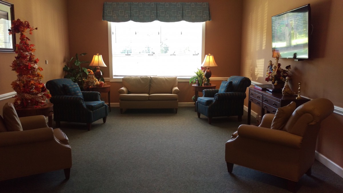 A cozy living room with comfortable seating and natural light.
