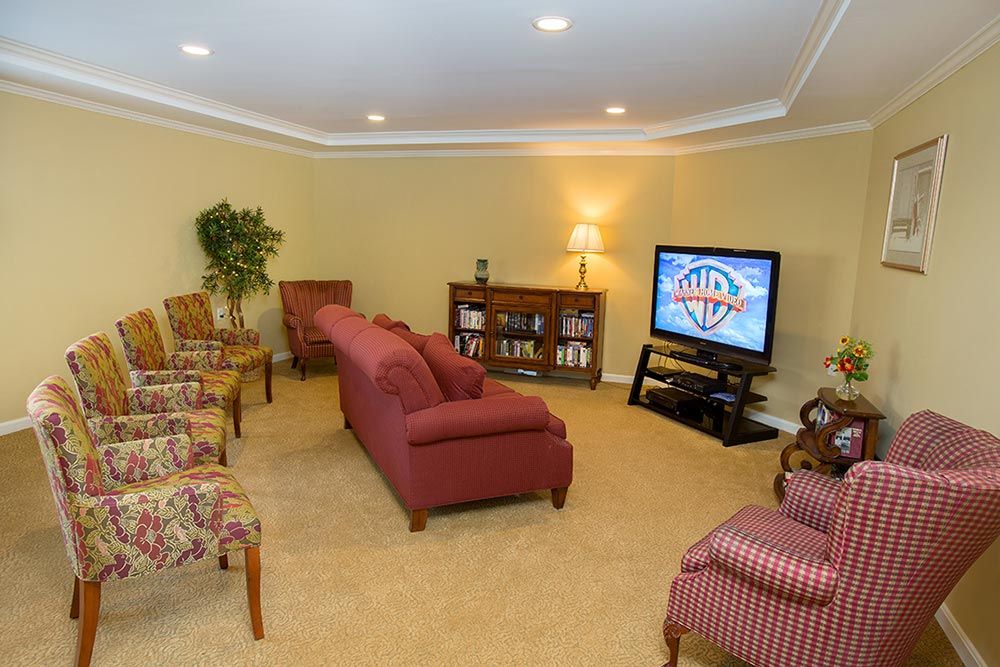 A cozy living room featuring comfortable seating and a television.