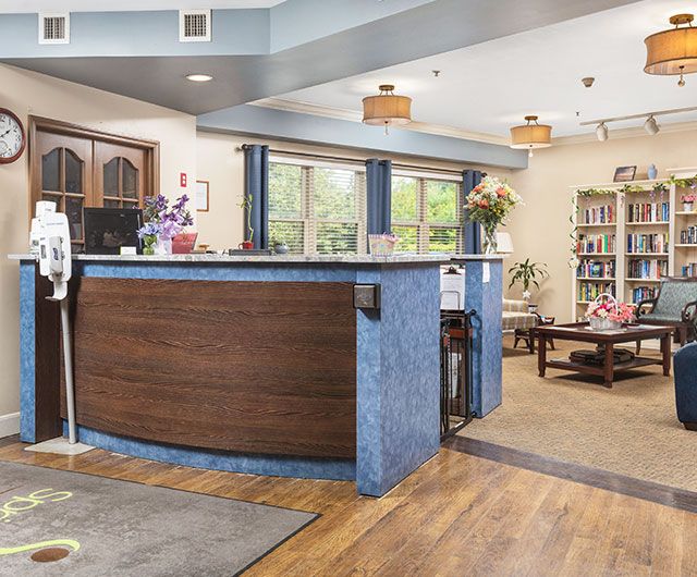 A welcoming reception area with a modern desk and comfortable seating.