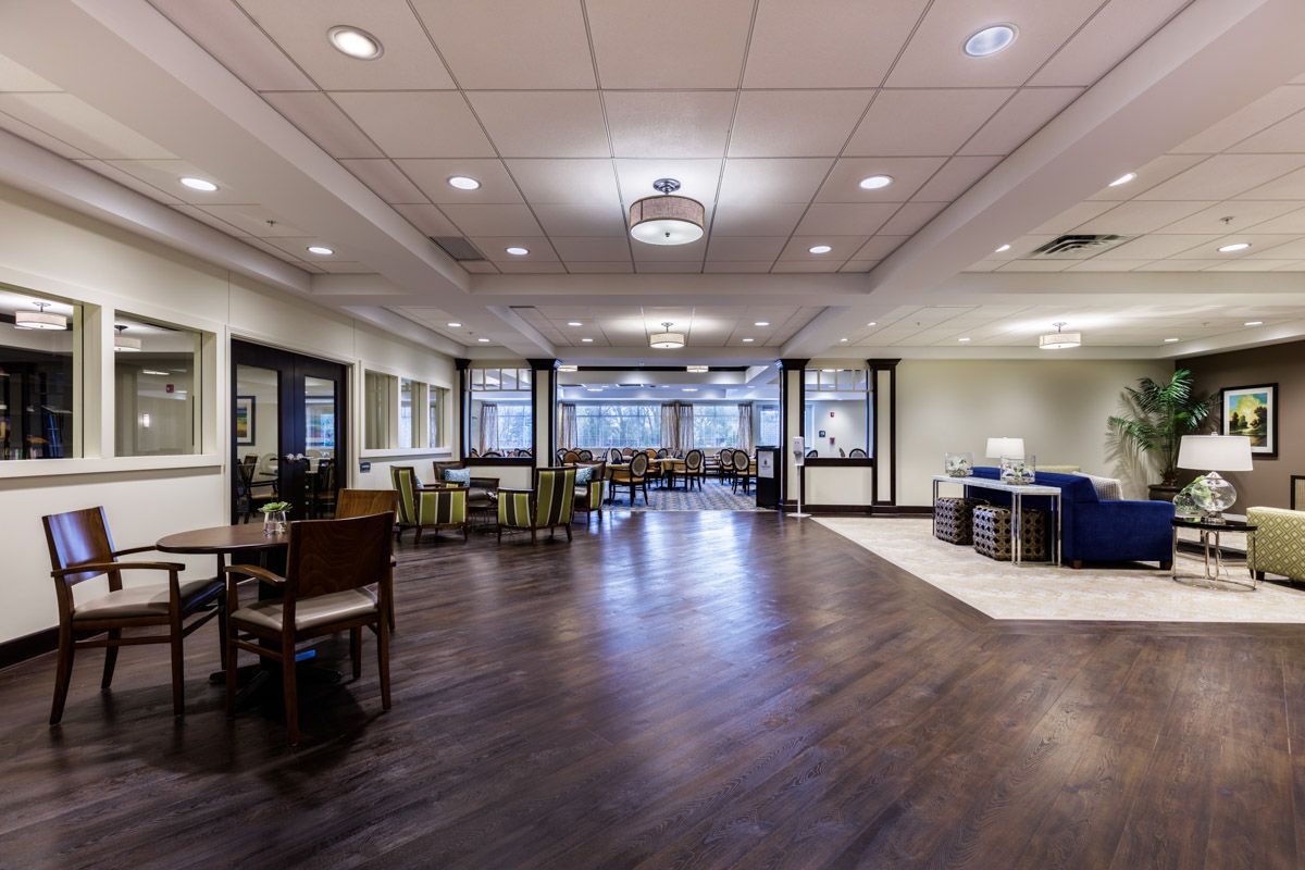 A spacious, modern dining area with stylish furnishings and elegant lighting.