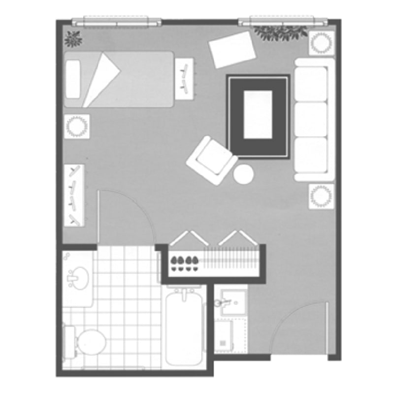 Studio apartment floor plan featuring a combined living and sleeping area, kitchen, and bathroom.