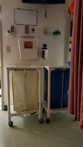 Laundry bins in a hospital setting for collecting used linens.