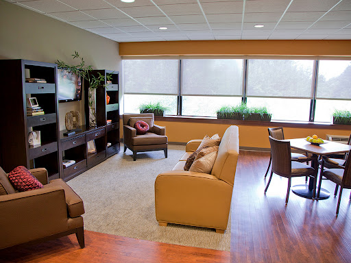 A cozy and inviting living room with comfortable seating and ample natural light.