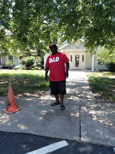 A proud dad enjoying a sunny day outdoors.