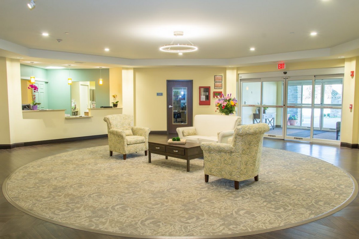 A well-lit and elegantly decorated lobby with comfortable seating arrangements.