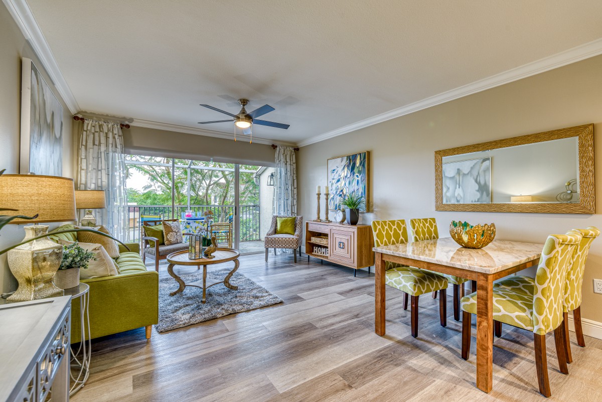 A modern living and dining space with stylish decor and ample natural light.